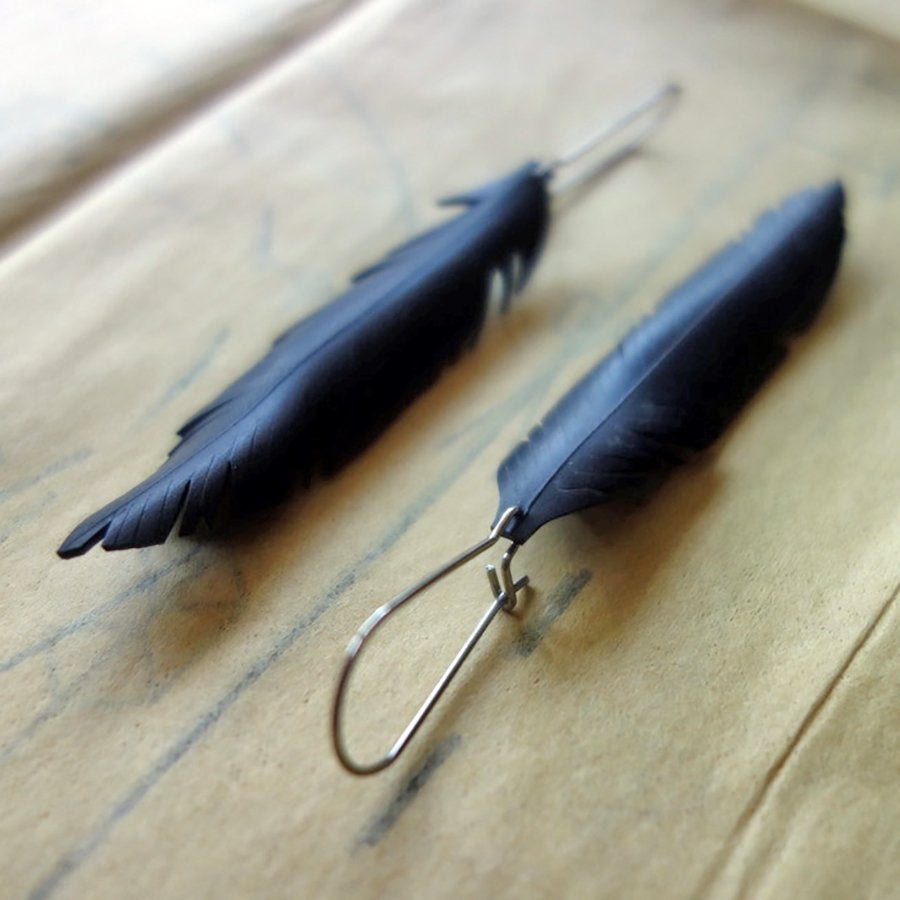 Up-cycled petite single feather earrings