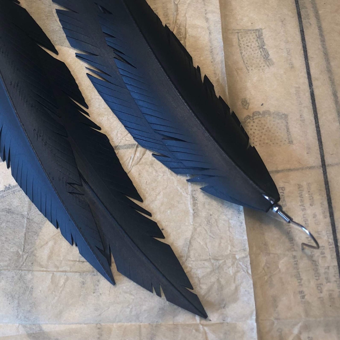 Up-cycled large double feather earrings