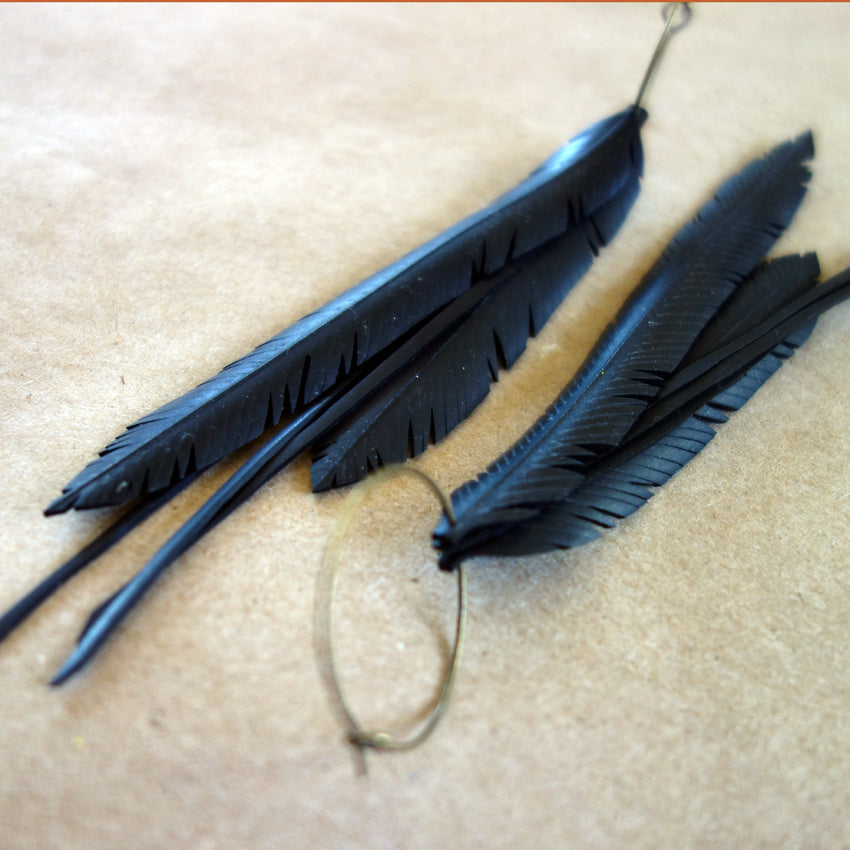 Up-cycled multi feather earrings